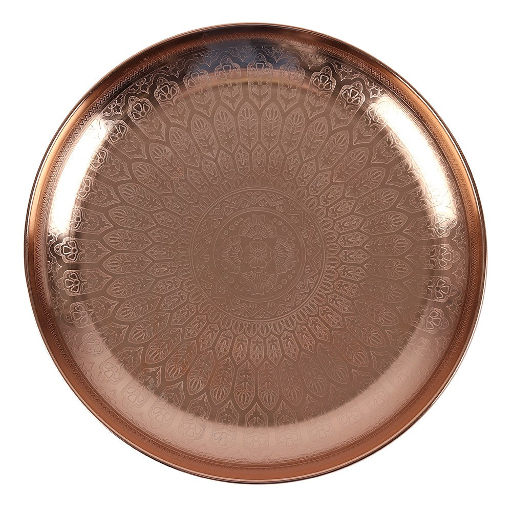 Decorative copper tray with intricate patterns on a white background