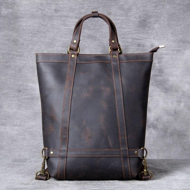 Brown leather tote bag on a gray background
