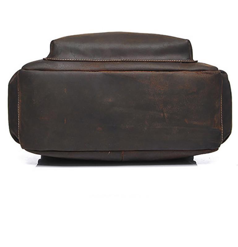 Brown leather ottoman on a white background seen from the bottom of the bag