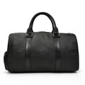 Black leather duffel bag on a white background