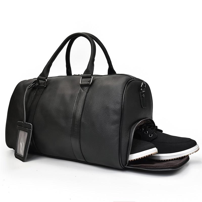 Black duffel bag with a shoe compartment on a white background