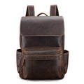 Brown leather backpack on a white background
