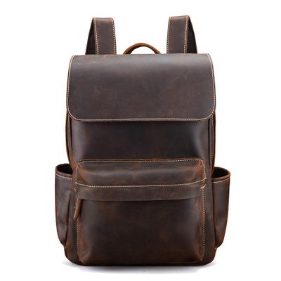 Brown leather backpack on a white background