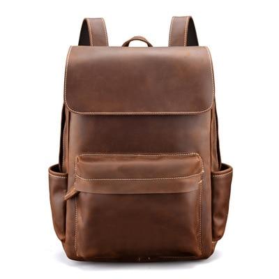 Brown leather backpack on a white background
