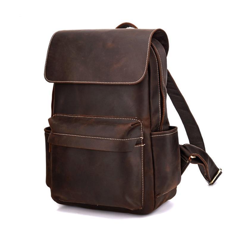Brown leather backpack on a white background